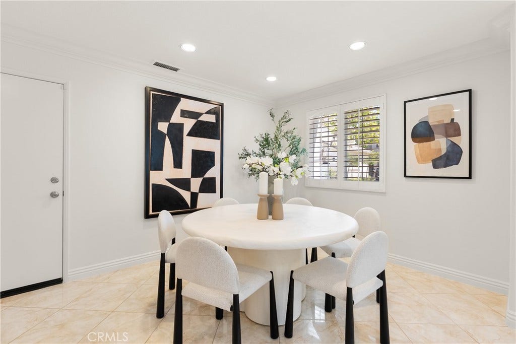 15 Poppyfield, Rancho Santa Margarita, CA 92688 Bright dining area with plantation shutters and an open layout that flows effortlessly into the main living spaces, creating an inviting setting for everyday meals and entertaining.