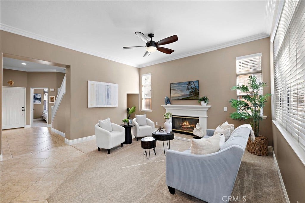 27 Las Cruces, Rancho Santa Margarita, CA 92688 Check out this large living area complete with a fireplace and niche for your extra space needs. High ceilings make this very light and bright.