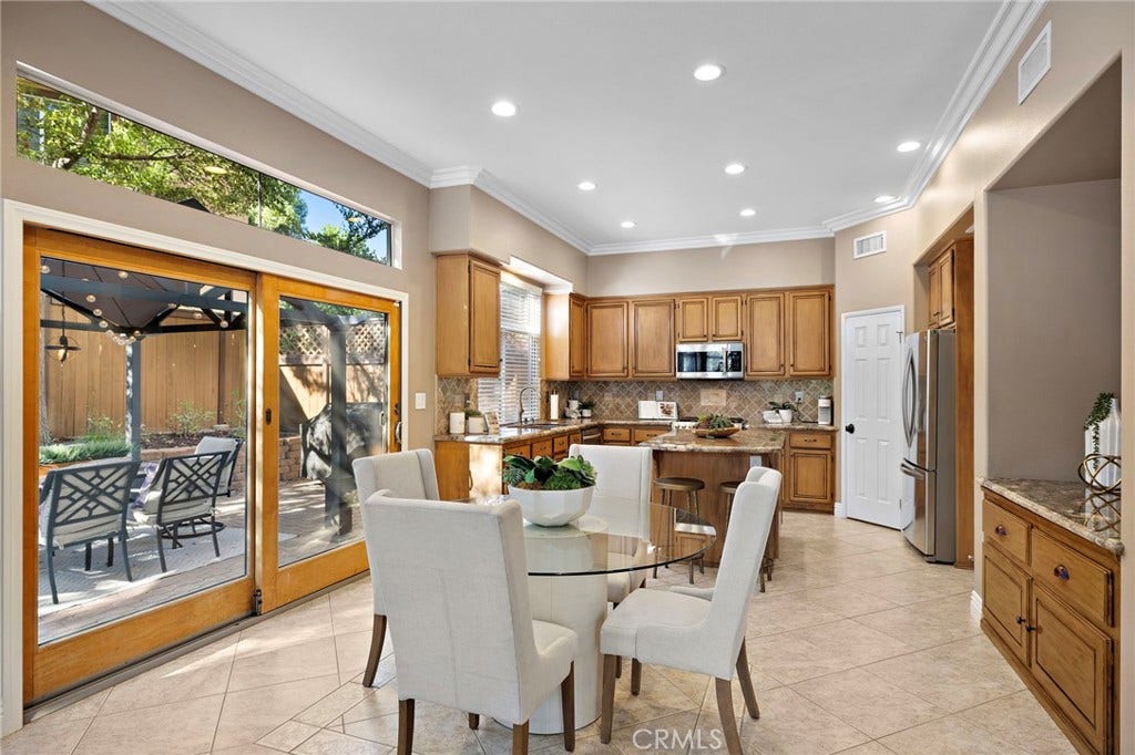 27 Las Cruces, Rancho Santa Margarita, CA 92688 The eating area is adjacent to the kitchen and living area so you have the open concept that is so popular. Custom sliding door and a built-in buffet are a bonus.