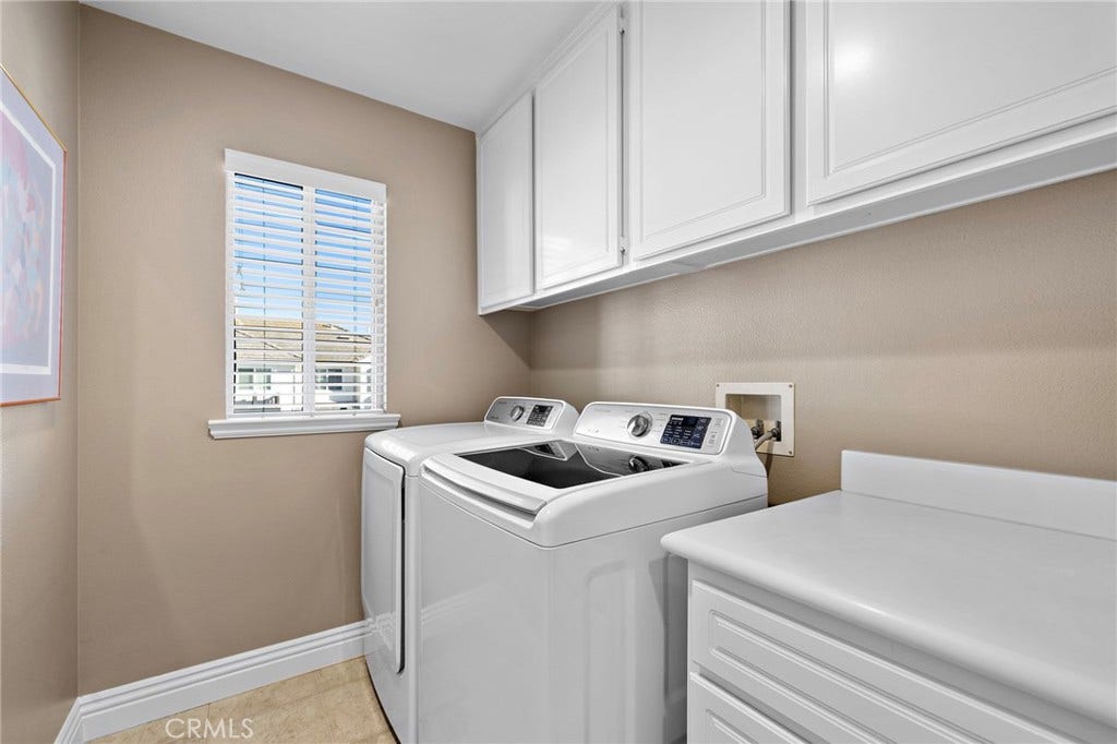 27 Las Cruces, Rancho Santa Margarita, CA 92688 Laundry room with lots of cabinets for storage and conveniently located upstairs.