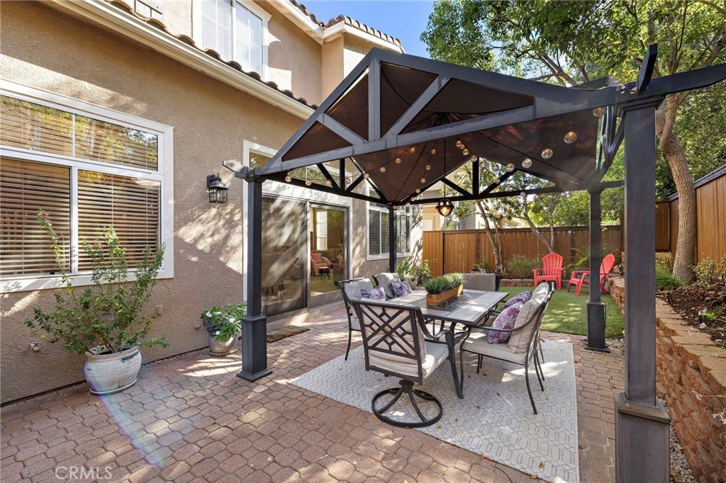 27 Las Cruces, Rancho Santa Margarita, CA 92688 The gazebo will remain with the home so you have a shady area to enjoy dining outdoors.
