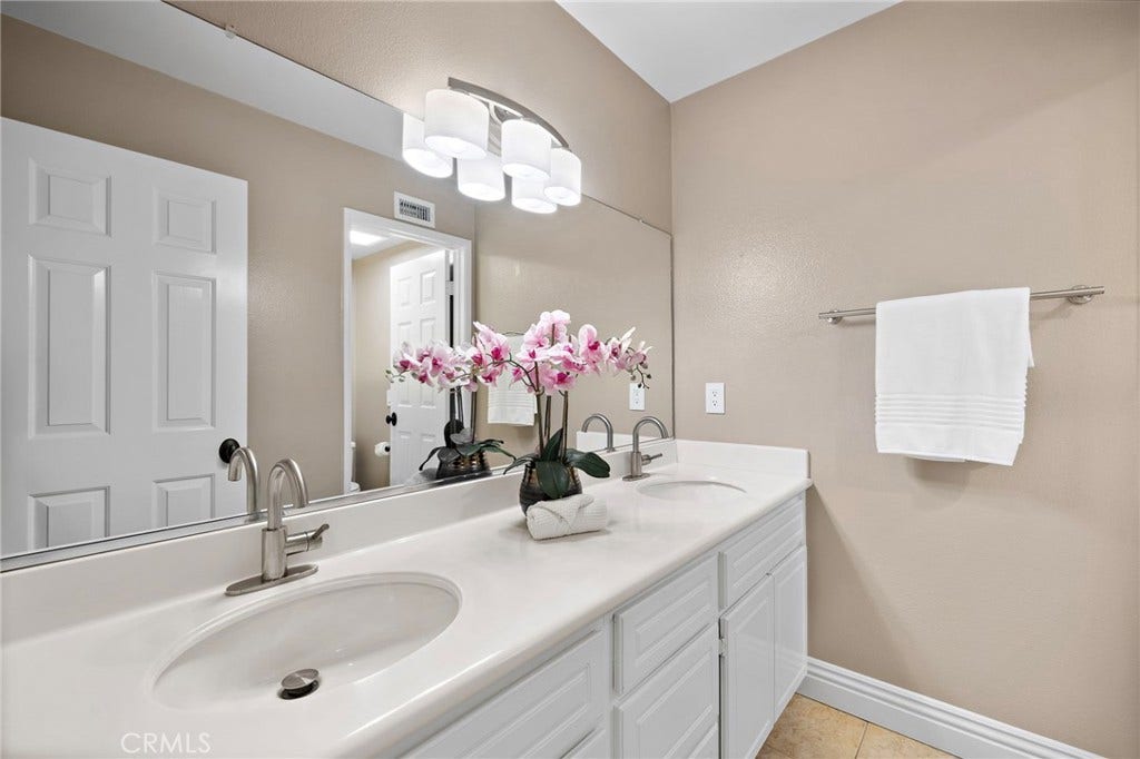 27 Las Cruces, Rancho Santa Margarita, CA 92688 Secondary bathroom upstairs. Dual sinks AND the shower area has a door for privacy if needed.