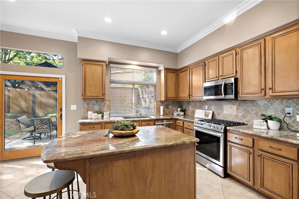 27 Las Cruces, Rancho Santa Margarita, CA 92688 You will appreciate the center island for additional meal prep space and for the additional seating-perfect for the quick snack.