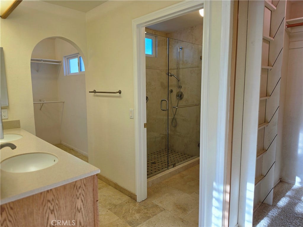 Remodeled Primary bath with additional 7/12 walk-in closet