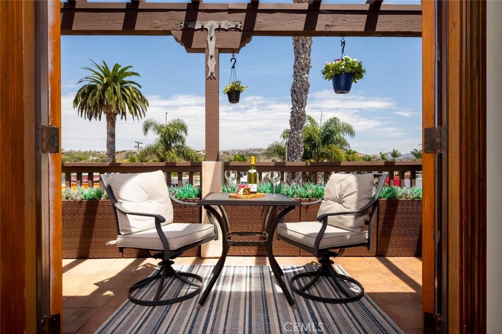 1520 N El Camino Real, #26, San Clemente, CA 92672 Private balcony adjacent to living room and open floor plan.