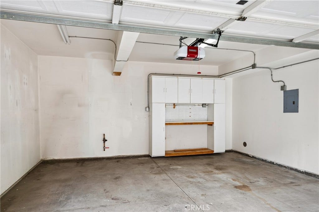 24 Mission Court, Lake Forest, CA 92610 2-Car Direct Access Garage with storage racks.