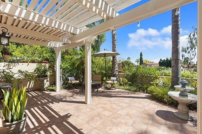 55 Fleurance, Laguna Niguel, CA 92677 Enjoy the view from your back yard oasis with a Saltillo tile floor, patio cover for shade, and mature tropical landscaping