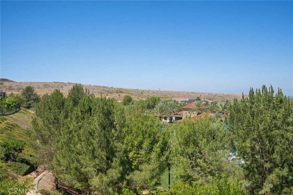 View of Clubhouse, no rear view neighbors or rooftops directly behind the home