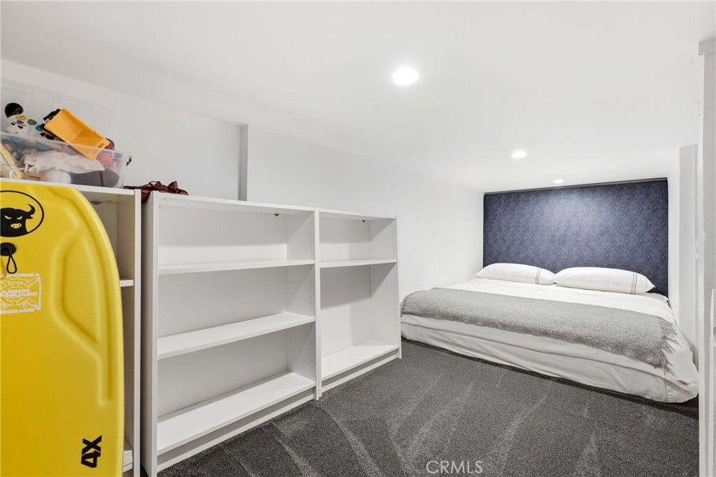 Secondary bedroom 2 with a play/sleeping loft and a built in bar.