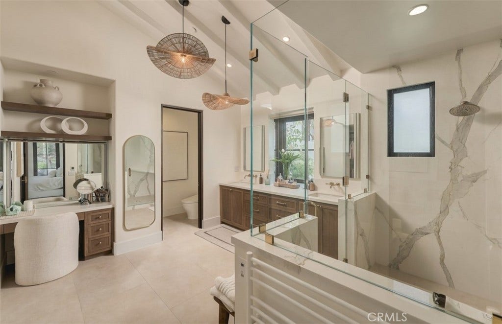 16 Pelican Point, Newport Coast, CA 92657 Primary bath with vanity and stone lined walk in shower.