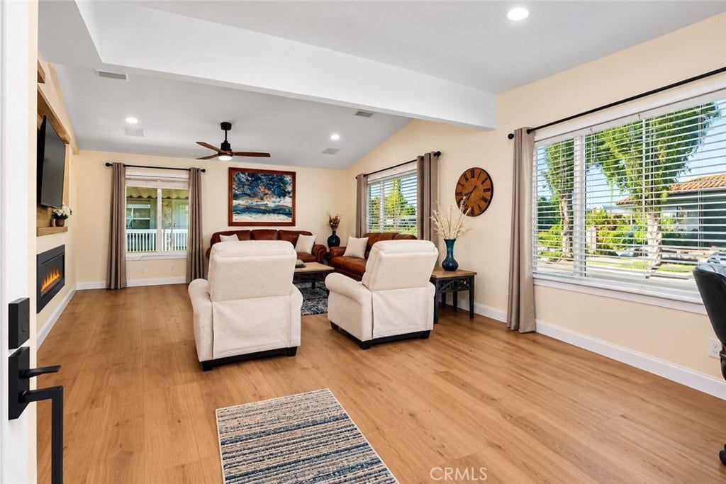 24701 Raymond Way, #135, Lake Forest, CA 92630 Inviting entry to the spacious living room and fireplace area.
