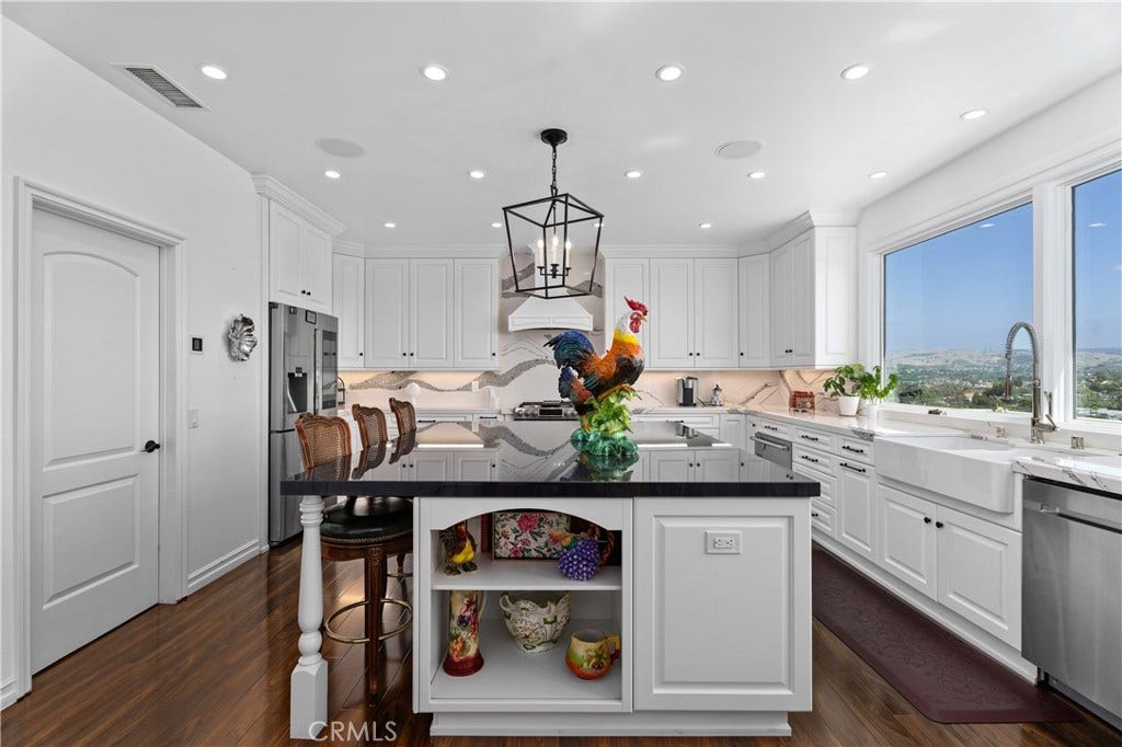 14 Marana, San Clemente, CA 92673 oversized gourmet kitchen is designed for the serious cook and entertainer, featuring generous workspace, 2 ovens, quartz countertops, a large pantry,