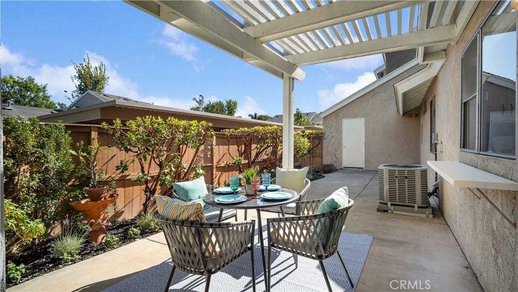 The backyard invites you to sit down and relax.