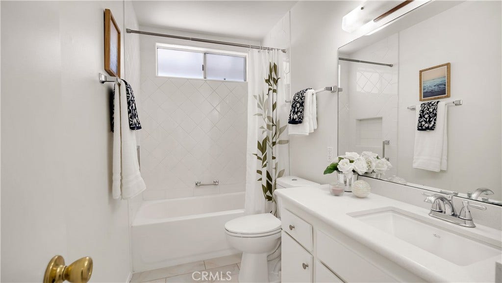 Secondary bathroom looks new.