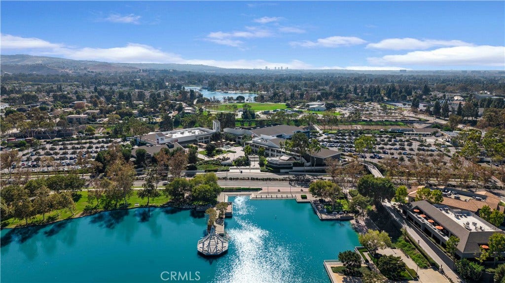 This drone shot shows the shopping center on Barranca; lots of places to eat too.