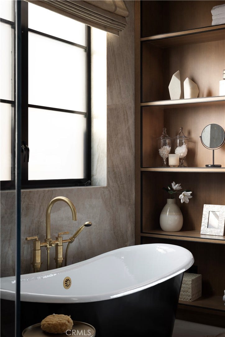Primary bath with Waterworks burnished brass fixtures, handcrafted tiles, and TOTO washlet.