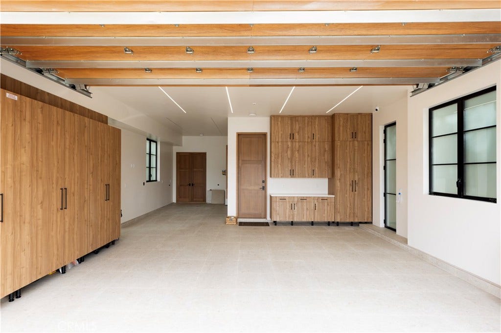 Showroom garage with custom storage, electrical and water filtration system. Room for a car lift