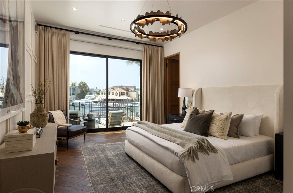 Dual primary suite with bay views.