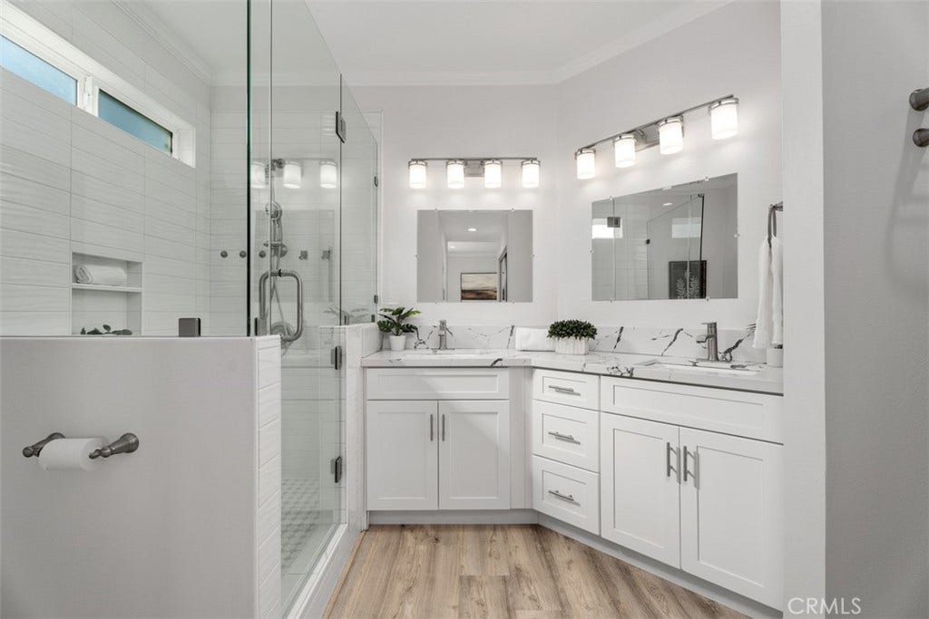 11 Calle Del Mar, Rancho Santa Margarita, CA 92688 Dual vanities, quartz countertops and a spacious walk-in shower create a bright, modern primary bath retreat.