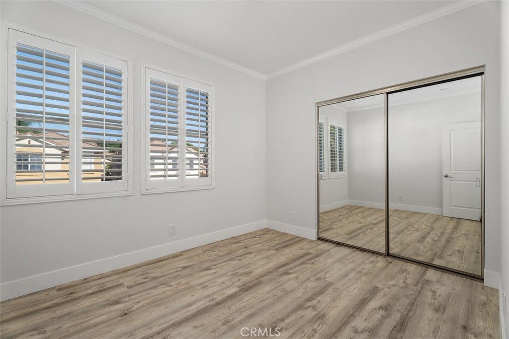 11 Calle Del Mar, Rancho Santa Margarita, CA 92688 Light and bright bedroom 2 upstairs with plantation shutters, mirrored closet doors and updated flooring.
