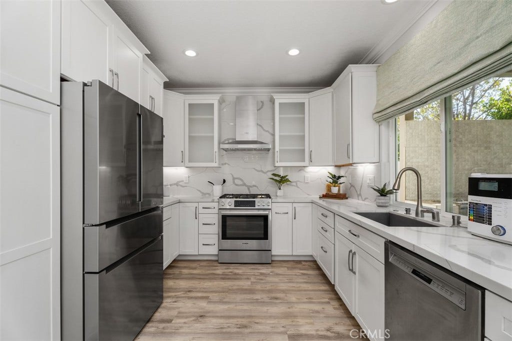 11 Calle Del Mar, Rancho Santa Margarita, CA 92688 Beautifully remodeled kitchen features white shaker cabinetry, quartz countertops, stainless steel Bosch appliances and abundant storage.