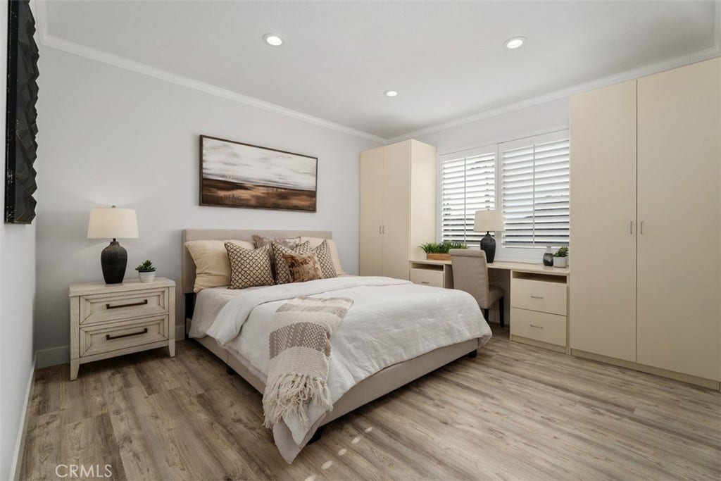 11 Calle Del Mar, Rancho Santa Margarita, CA 92688 Primary bedroom offers built in storage cabinetry and plenty of light and updated flooring.
