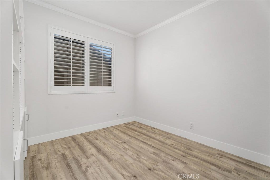 11 Calle Del Mar, Rancho Santa Margarita, CA 92688 Light and bright bedroom 3 with built in desk and shelving, plantation shutters, mirrored closet doors and updated flooring.