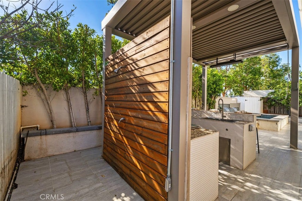 11 Calle Del Mar, Rancho Santa Margarita, CA 92688 Outdoor kitchen and entertaining area offers built-in cooking space, an outdoor shower and adjustable covered patio.