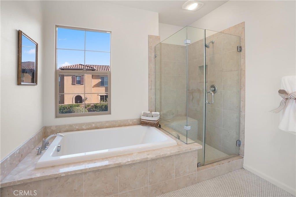 28242 Camino Del Rio, San Juan Capistrano, CA 92675 Primary bathroom featuring a soaking tub and separate glass enclosed walk in shower.