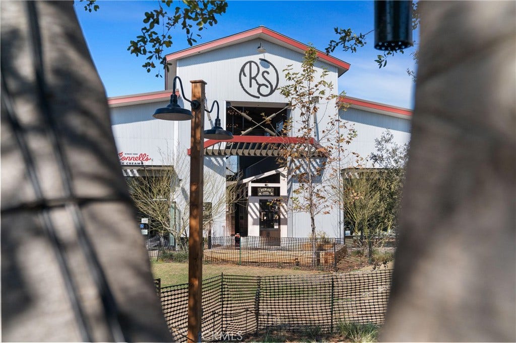 28242 Camino Del Rio, San Juan Capistrano, CA 92675 River Street Marketplace showcasing its distinctive architecture and collection of local businesses.