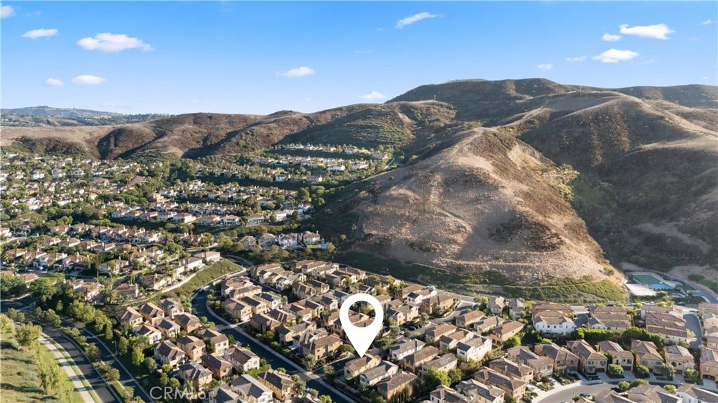 28242 Camino Del Rio, San Juan Capistrano, CA 92675 Aerial neighborhood view highlighting the homes location among the surrounding rolling hills.