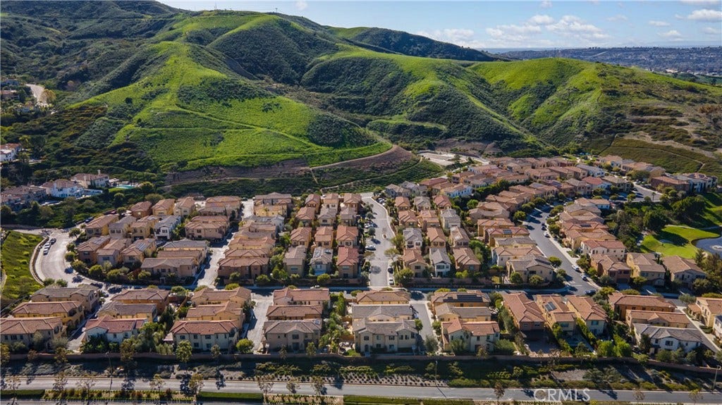 28242 Camino Del Rio, San Juan Capistrano, CA 92675 Aerial view showcasing the community nestled against scenic rolling hills.