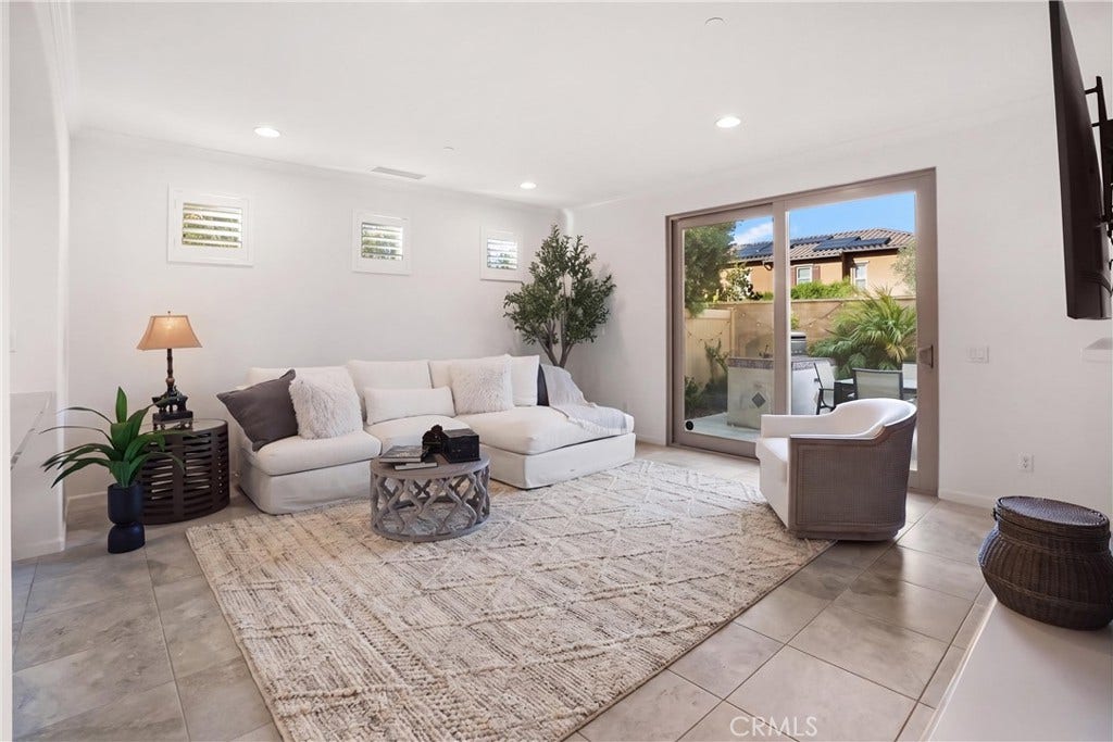 28242 Camino Del Rio, San Juan Capistrano, CA 92675 Spacious family room filled with natural light and offering direct access to the outdoor entertaining area.