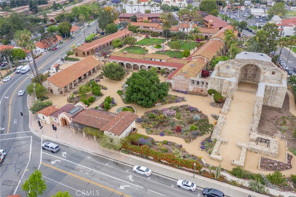 28242 Camino Del Rio, San Juan Capistrano, CA 92675 Aerial view of the historic Mission San Juan Capistrano and its surrounding gardens in the heart of downtown.