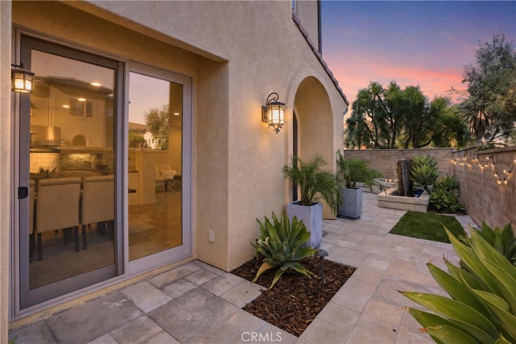 28242 Camino Del Rio, San Juan Capistrano, CA 92675 Private courtyard-style outdoor space with custom fountain, hardscape, landscaping, and direct access to the homes interior living spaces.