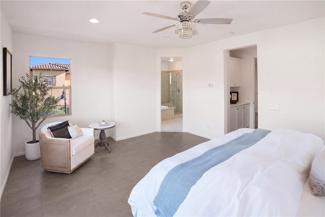28242 Camino Del Rio, San Juan Capistrano, CA 92675 Spacious primary suite with a dedicated sitting area and direct access to the primary bathroom.