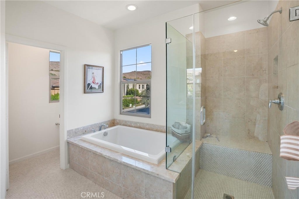 28242 Camino Del Rio, San Juan Capistrano, CA 92675 Primary bathroom featuring a soaking tub and separate glass enclosed walk in shower.