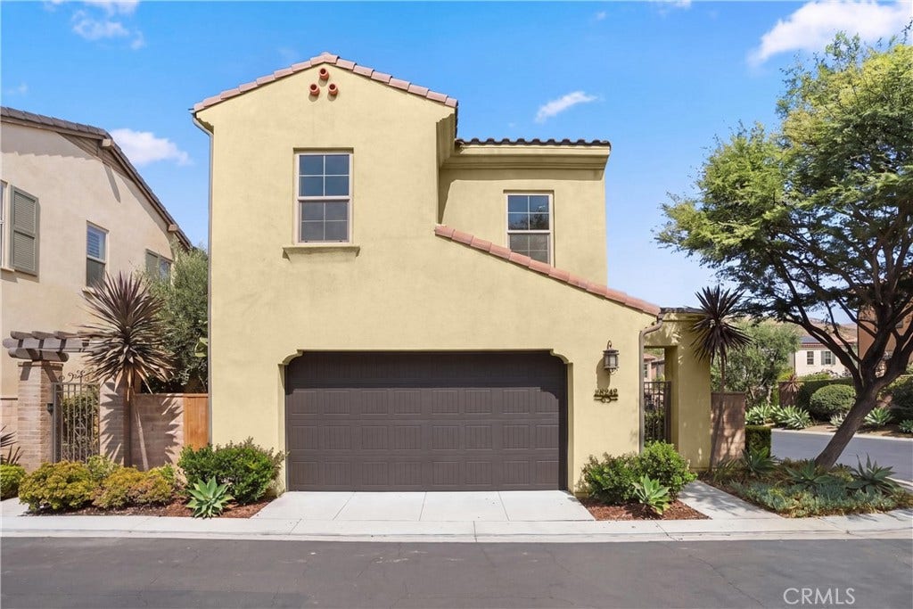 28242 Camino Del Rio, San Juan Capistrano, CA 92675 Front exterior showcasing the homes Spanish-inspired architecture, two-car garage, and well-maintained landscaping.