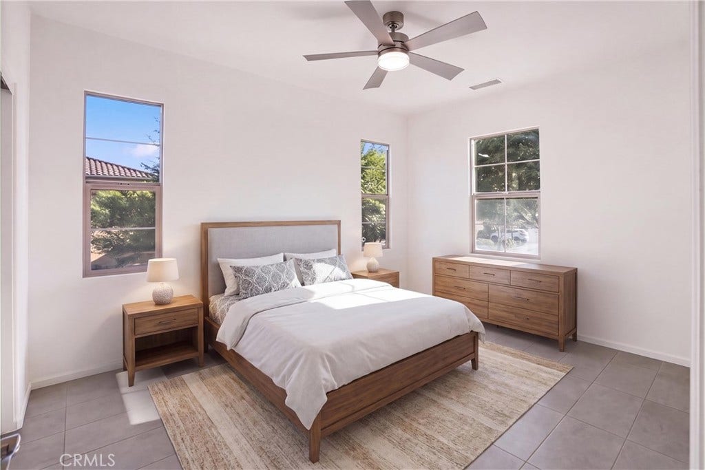 28242 Camino Del Rio, San Juan Capistrano, CA 92675 VIRTUALLY STAGED Secondary bedroom showcasing the rooms spacious layout, natural light, and multiple windows.