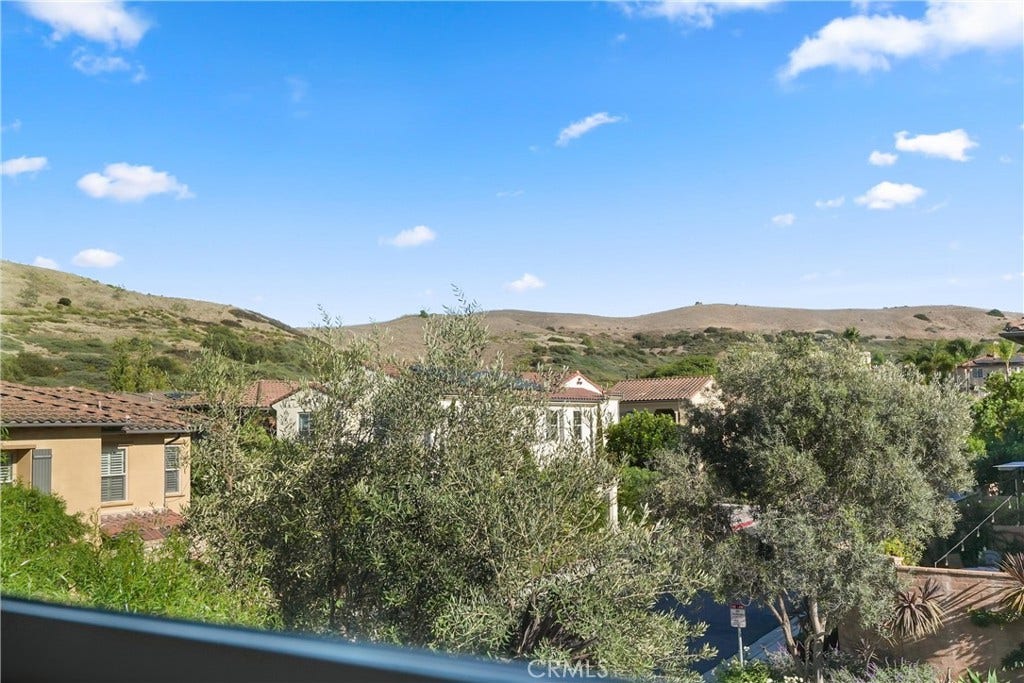 28242 Camino Del Rio, San Juan Capistrano, CA 92675 Hillside and neighborhood views enjoyed from the primary bedroom.