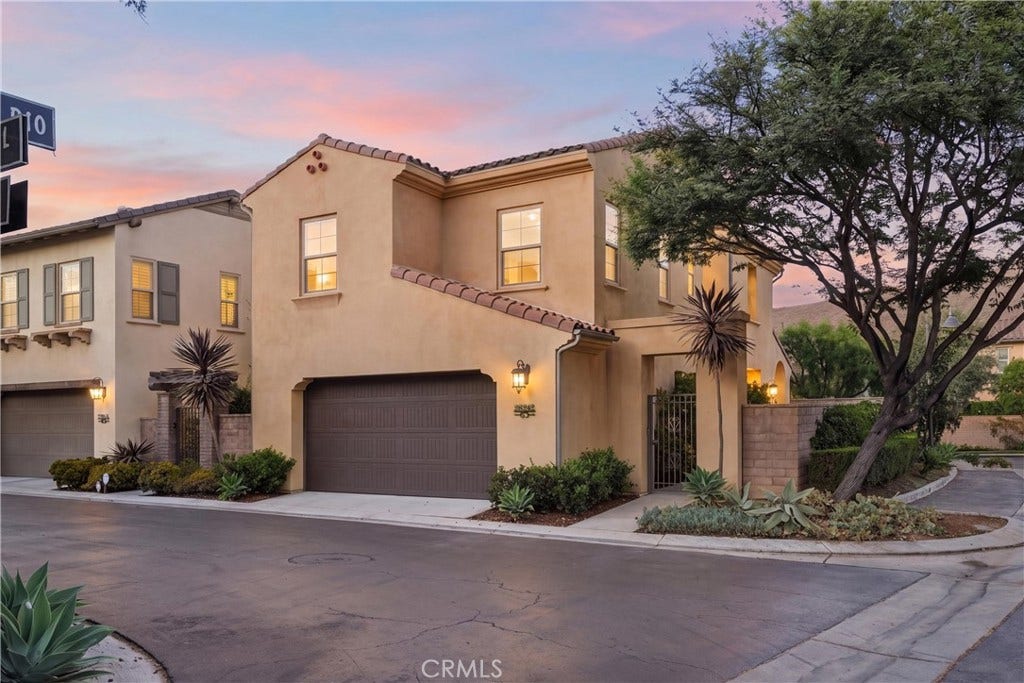 28242 Camino Del Rio, San Juan Capistrano, CA 92675 Twilight exterior showcasing the homes desirable corner lot location, Spanish-inspired architecture, mature landscaping, and inviting curb appeal.