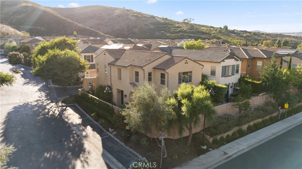 28242 Camino Del Rio, San Juan Capistrano, CA 92675 Aerial view showcasing the home within the surrounding neighborhood and scenic hillside setting.