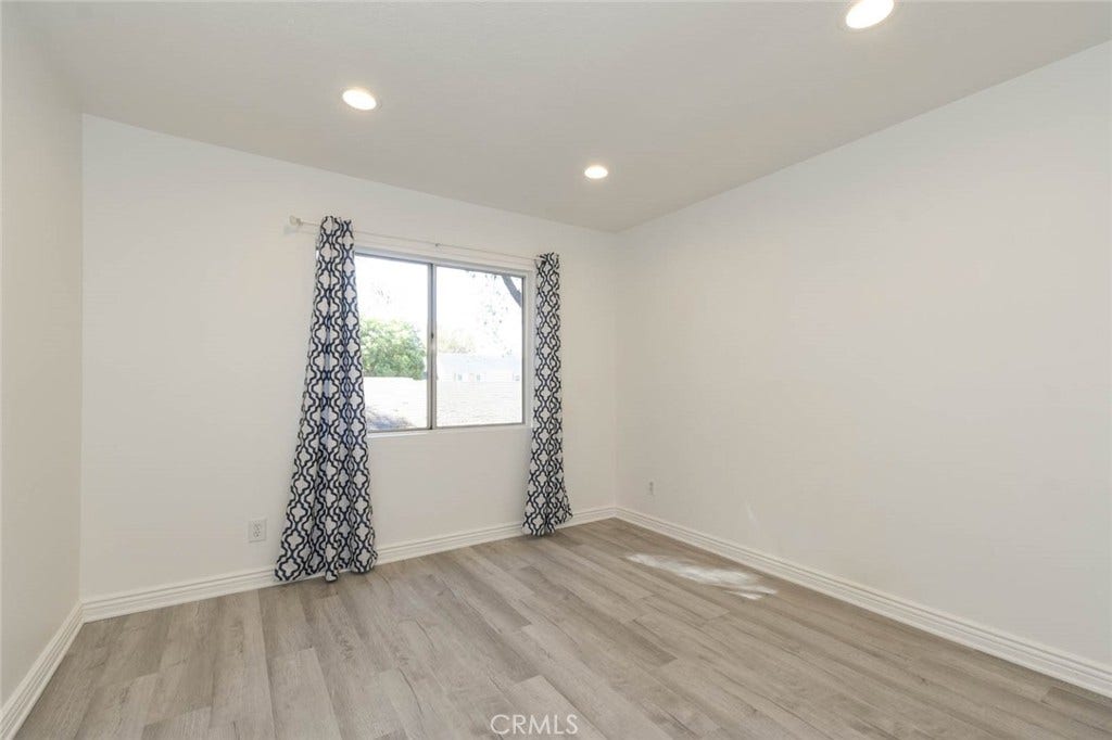 23472 Cambridge Road, #297, Yorba Linda, CA 92887 The secondary bedroom has recess ceiling lights and laminate flooring. Clean and ready to move-in.
