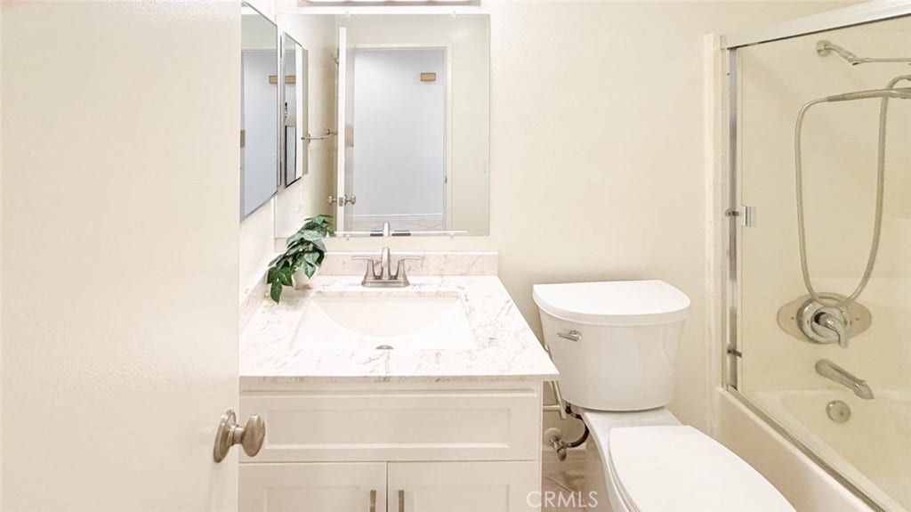 23472 Cambridge Road, #297, Yorba Linda, CA 92887 The hall way bathroom has nice vanity and a tub/shower combo.