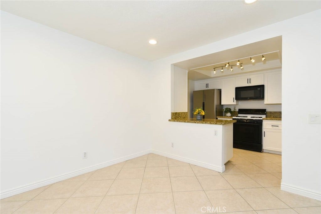 23472 Cambridge Road, #297, Yorba Linda, CA 92887 The remodeled kitchen is adjacent to the dining room.