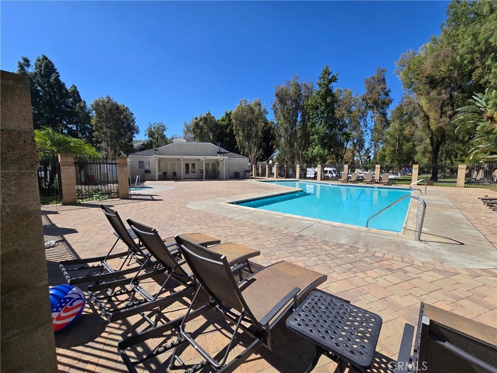 23472 Cambridge Road, #297, Yorba Linda, CA 92887 The Association Pool and the club house.