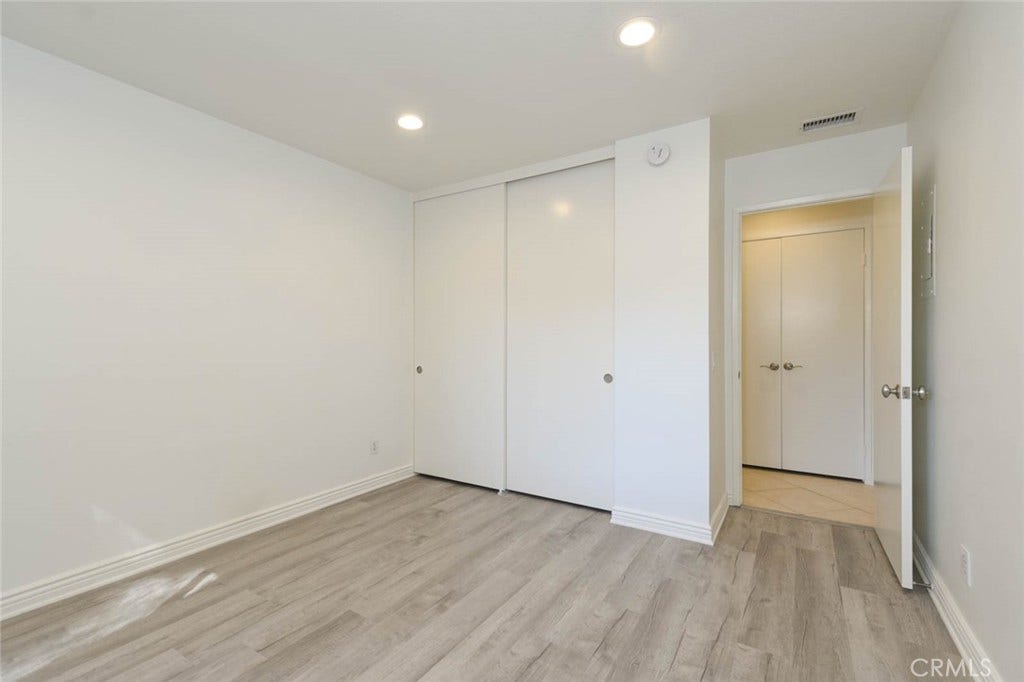 23472 Cambridge Road, #297, Yorba Linda, CA 92887 Good-size closet in the secondary bedroom. The double doors across the hallway open up to more closet space.