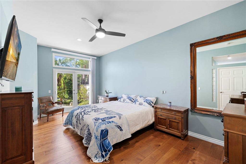 Primary Bedroom /w French Door to Lush Backyard