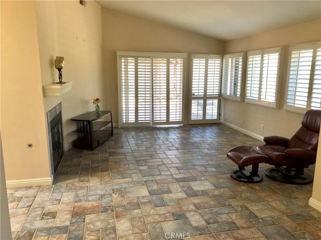 Large living area that opens to a large back yard and patio where you can enjoy the view and ocean breeze.