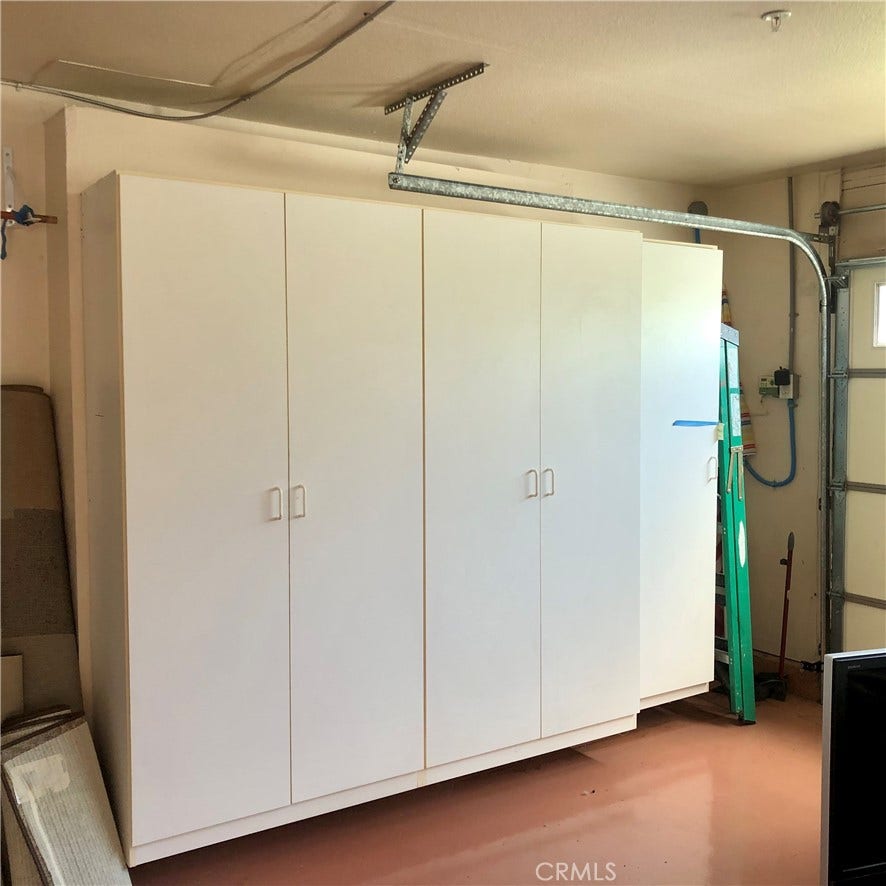 Plenty of cabinets in the 2-car garage for storage